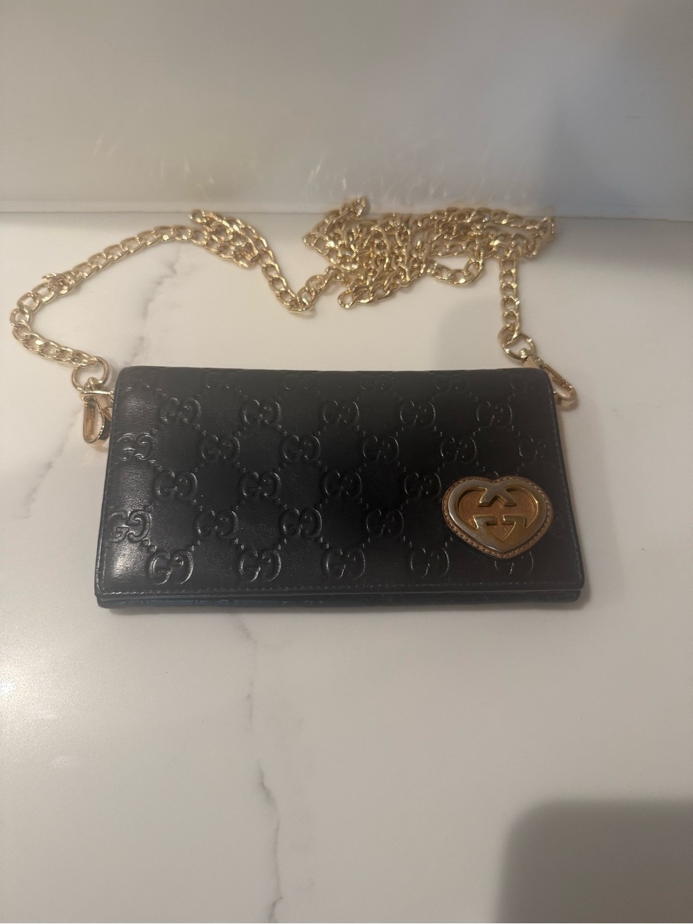 Authentic Gucci Black Leather GG Embossed Wallet with Gold Heart Chain